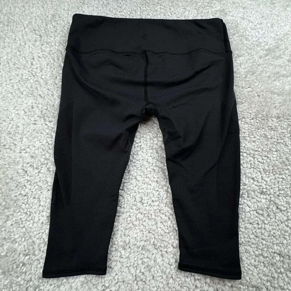 Lululemon Reveal Crop in Black. Mesh Sides. Size 12 or XL